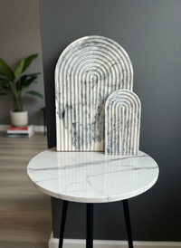 Modern marbled arch tray duo set including a large and small arch trays handmade by Sunni Dineen on a marble side table.