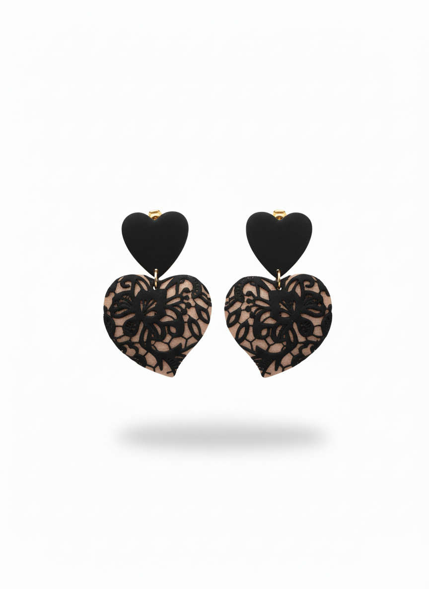 Black Lace Puffy Heart Statement Earrings handmade by Sunni Dineen, on a white background.
