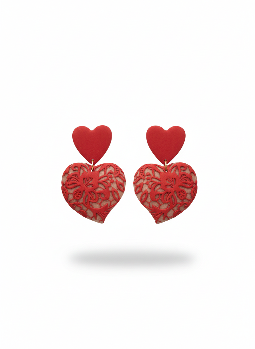Red Lace Puffy Heart Statement Earrings handmade by Sunni Dineen, on a white background.