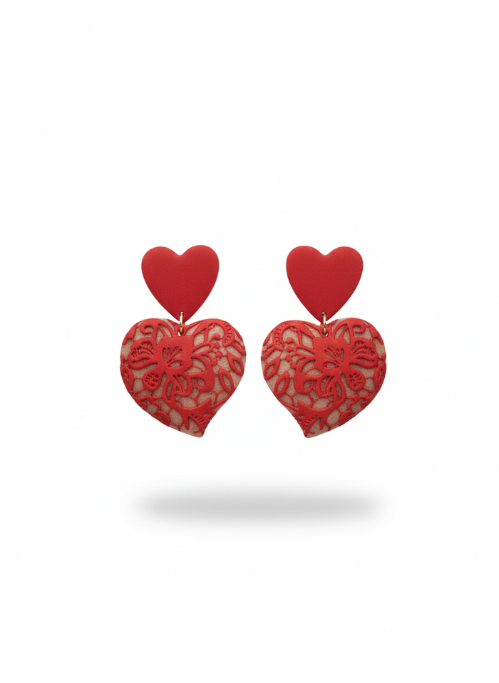 Red Lace Puffy Heart Statement Earrings handmade by Sunni Dineen, on a white background.