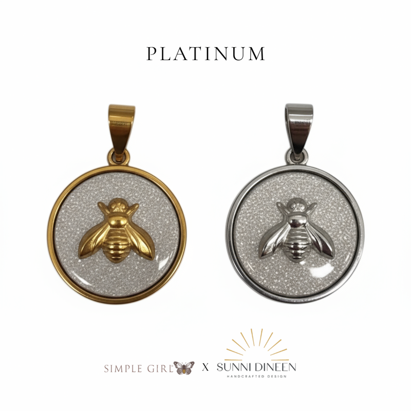 Queen Honeybee Necklace Pendants, one gold and one silver displayed on a white background with 'PLATINUM' text color option above by Simple Girl Brand X Sunni Dineen Handcrafted Design.