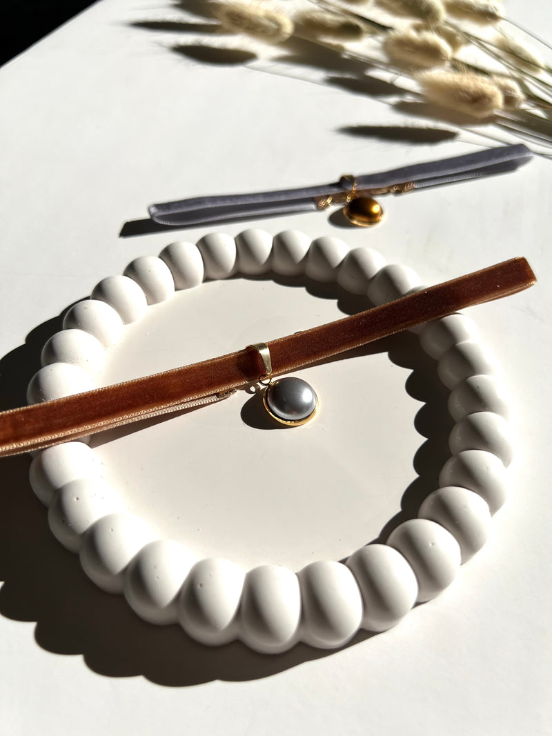 Modern handmade trinket tray styled with choker necklaces from Sunni Dineen Handcrafted Design; artisan jewelry and home accents created to empower women and redefine luxury.