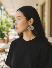 Model wearing ASHA zebra print handmade lightweight statement earrings from Sunni Dineen — artisan jewelry for women who redefine luxury with intention.