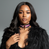 Woman wearing a black fur coat and the Pearlesque Choker Set handmade by Sunni Dineen, against a gray background