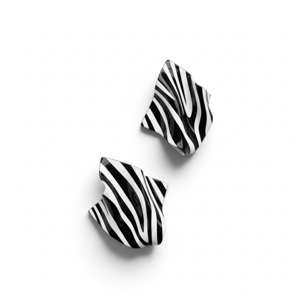  A pair of abstract zebra print Monae sculptural statement earrings