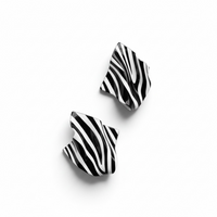  A pair of abstract zebra print Monae sculptural statement earrings