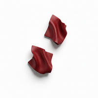  A pair of red Monae sculptural statement earrings