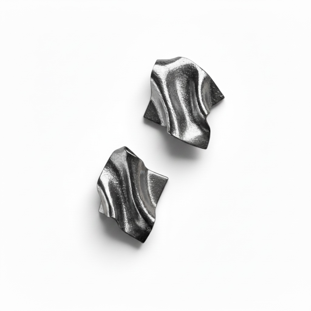 A pair of silver leaf Monae sculptural statement earrings