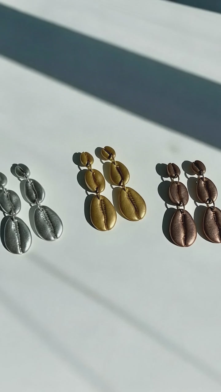 Video of The Cowrie Shell Tiered Drop Earrings handmade by Sunni Dineen.