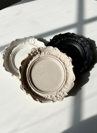 The Black, ivory and natural colored Resin Baroque Trinket Dishes handmade by Sunni Dineen.