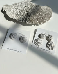 Silver Leaf Seashell Bauble Earring Set displayed on Sunni Dineen earring cards with a white coral in the background.