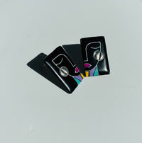 Black-colored 'Simone' abstract face statement stud earrings handmade from polymer clay.